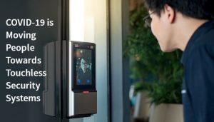 Person using facial recognition touchless security system.